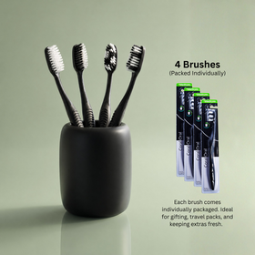 Four Coral Oral single-pack toothbrushes arranged for daily use