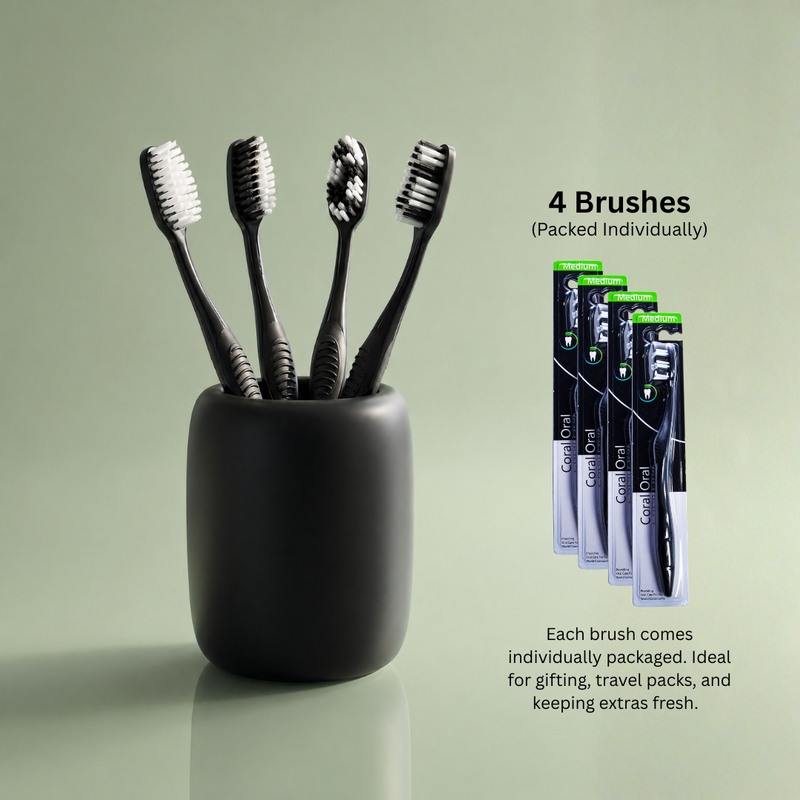 Four Coral Oral single-pack toothbrushes arranged for daily use